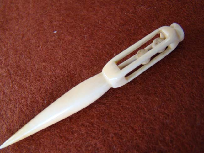 A 19th century sailor carved whalebone bodkin with cage handle